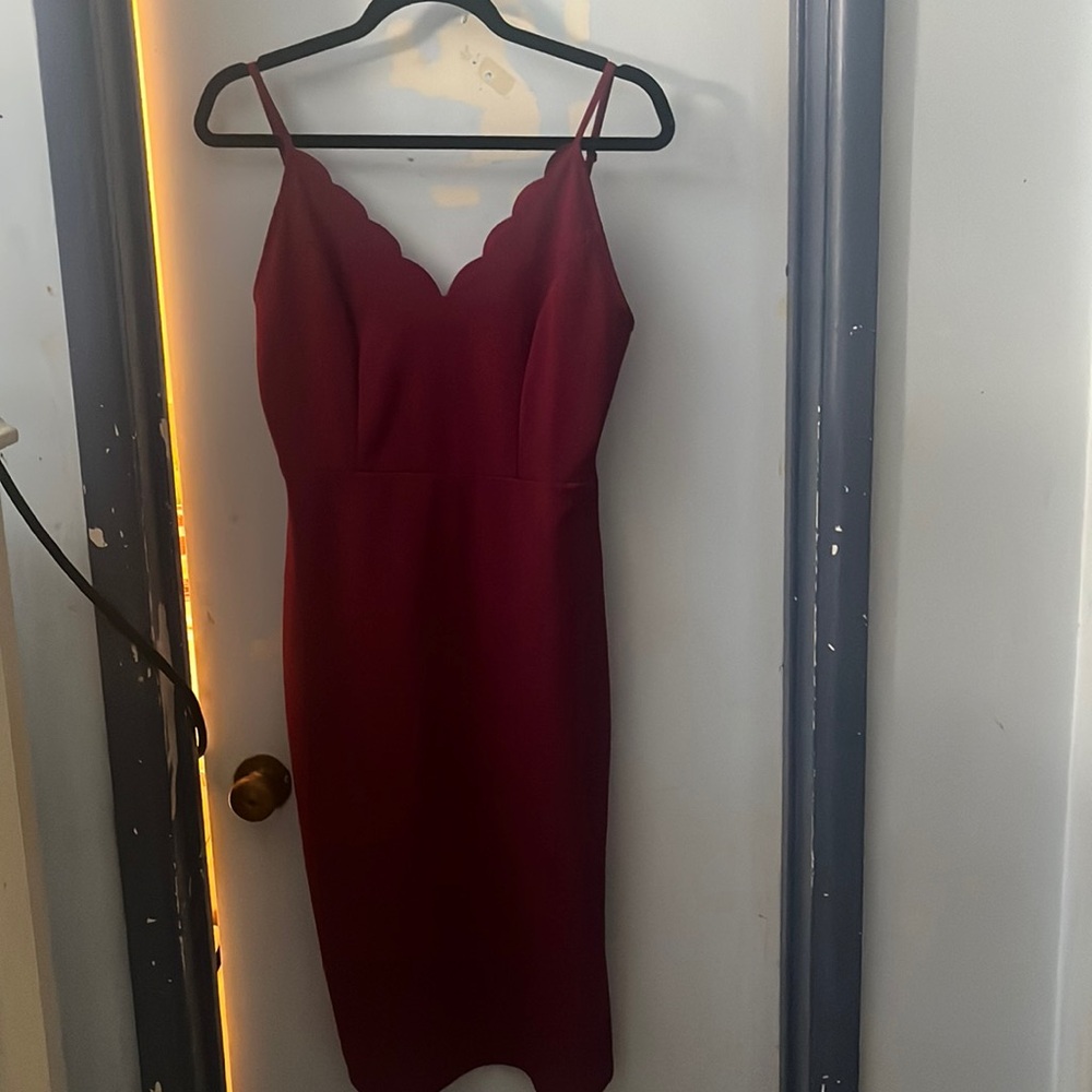 Burgundy socialite dress, mid calf length with 10 inch slit on left side.